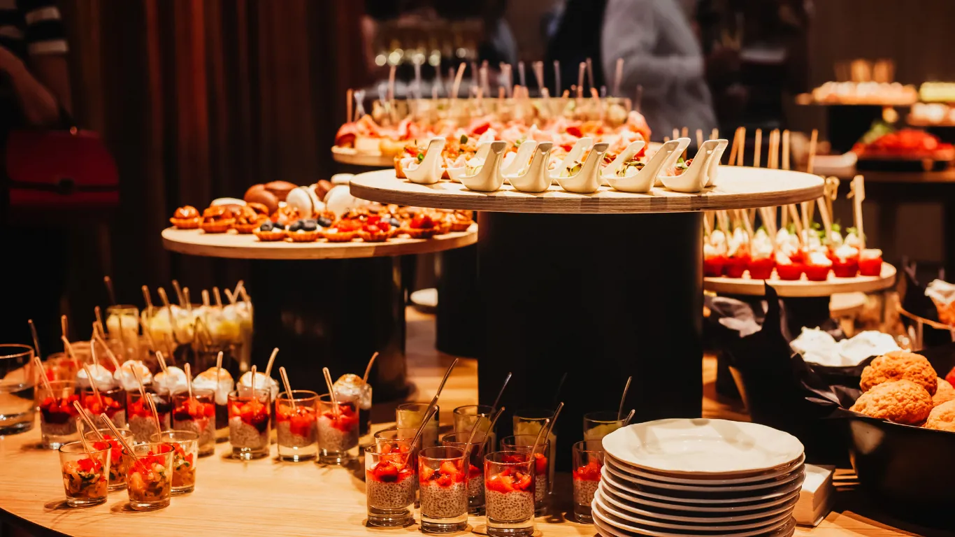 CanapΓ©s and shooters set out for a corporate reception catered by Claire's Kitchen